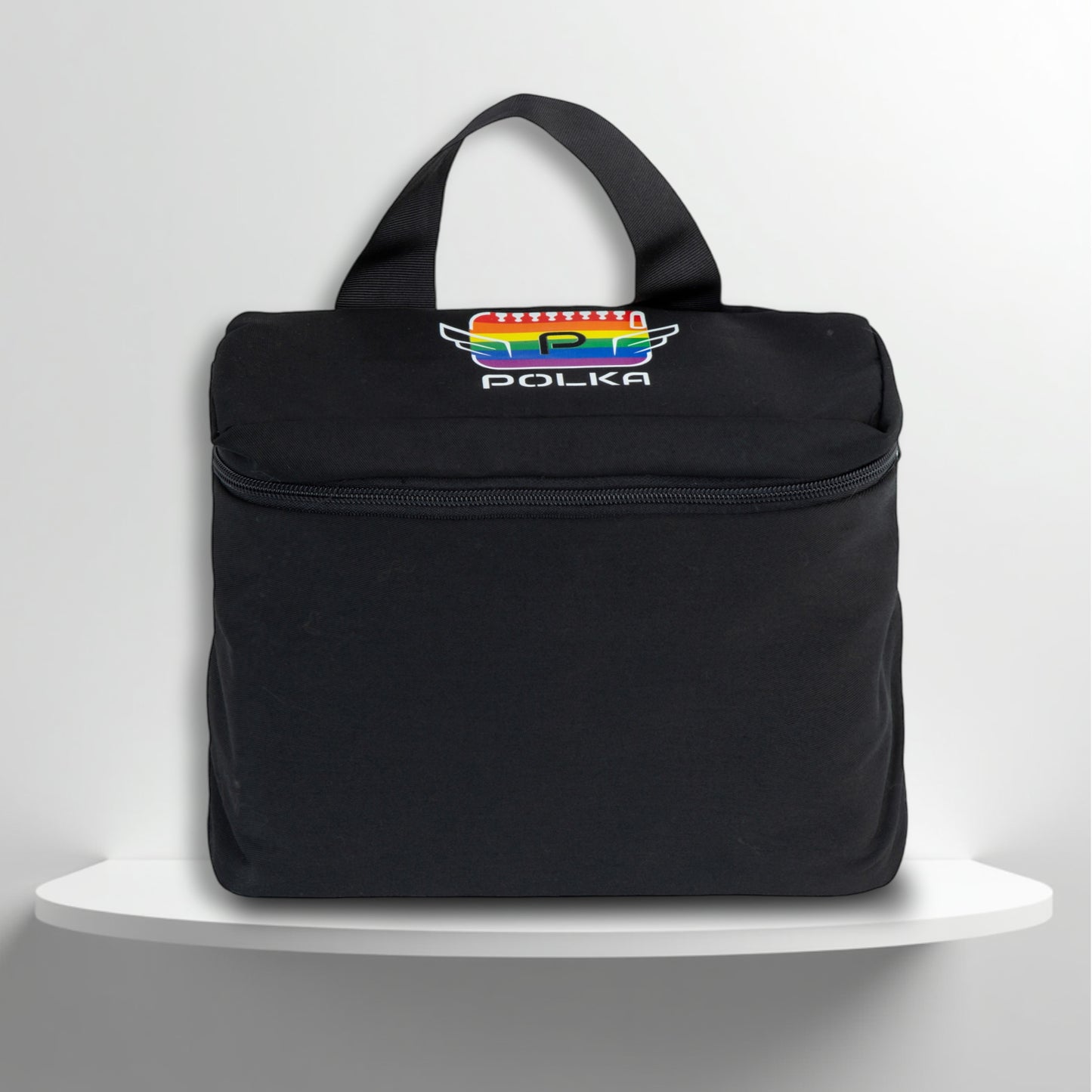 A black cotton travel vanity bag with many Greek travel size personal hygiene products inside for the LGBTQ+ community 