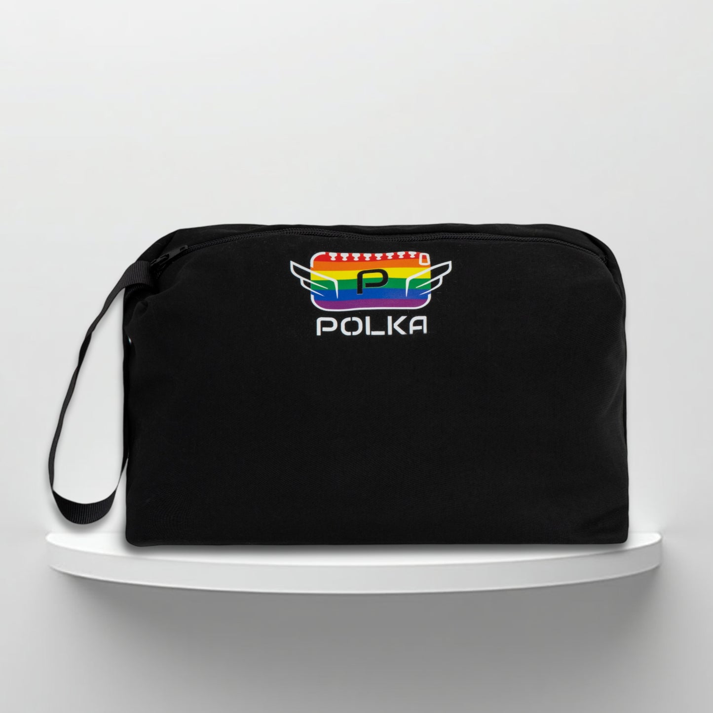 A black cotton travel vanity bag with many Greek travel size personal hygiene products inside 