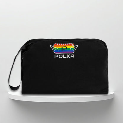 A black cotton travel vanity bag with many Greek travel size personal hygiene products inside 