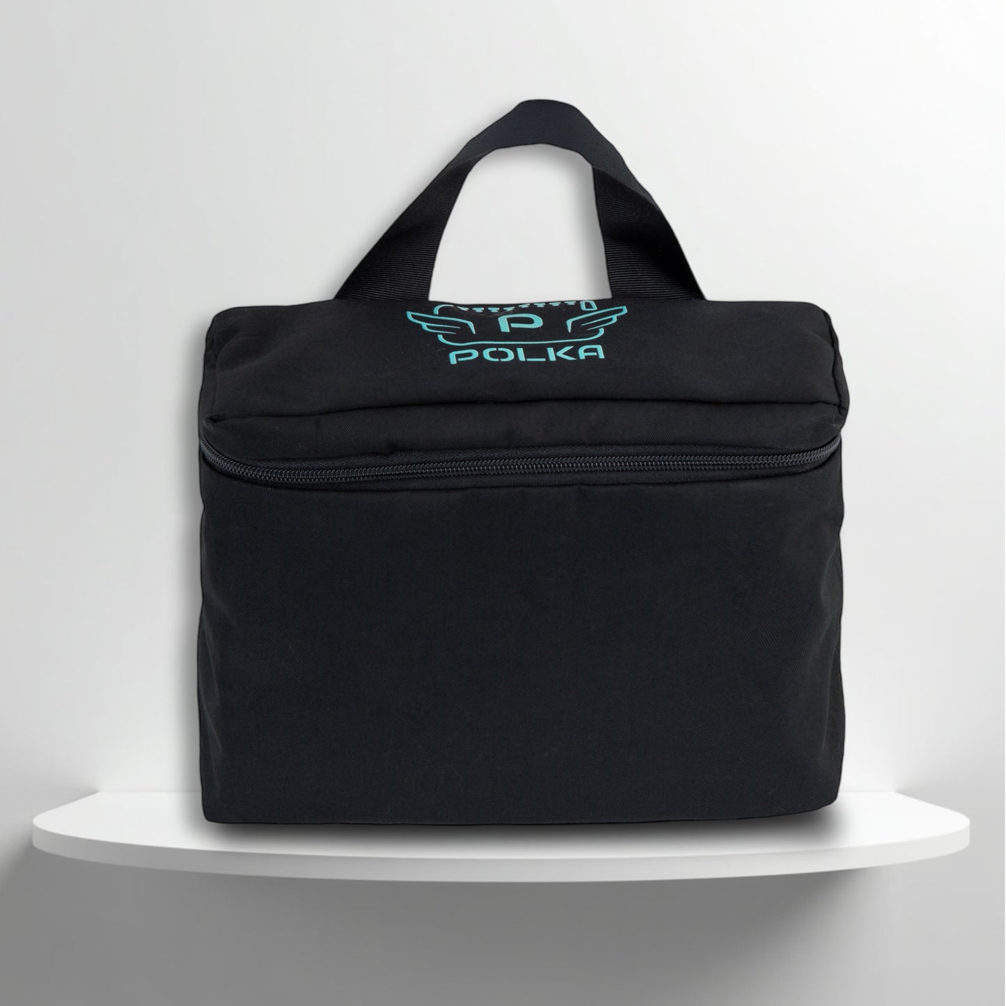 A Black cotton travel vanity bag with many Greek travel size personal hygiene products inside 
