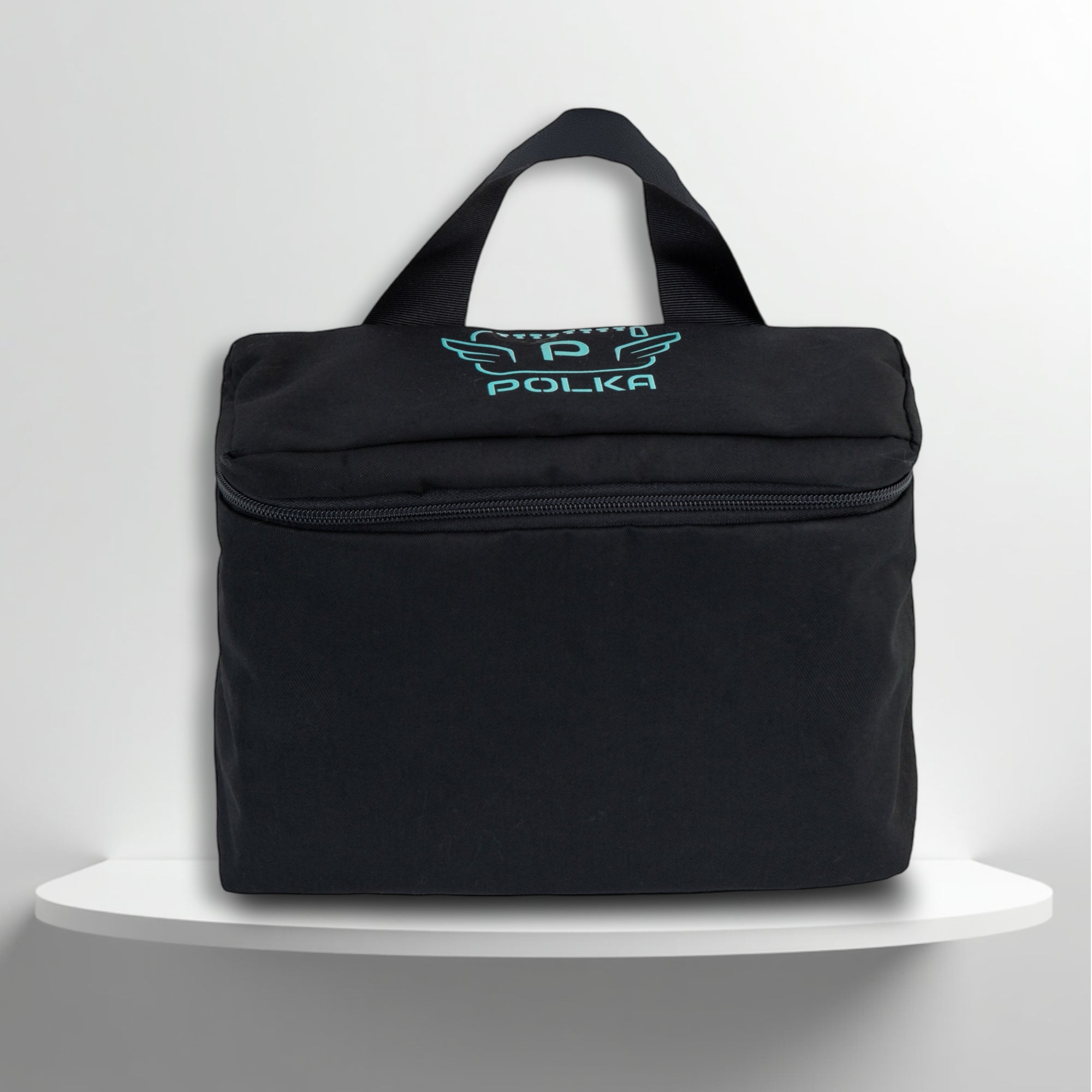 A Black cotton travel vanity bag with many Greek travel size personal hygiene products inside 
