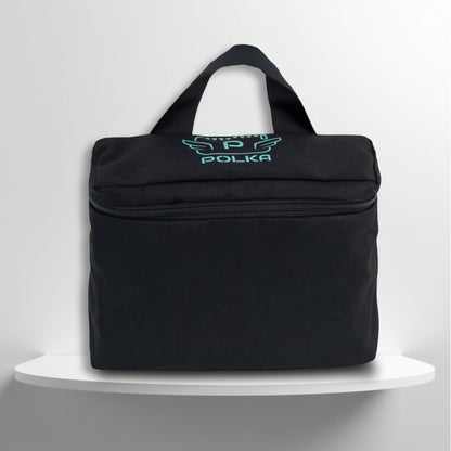 A Black cotton travel vanity bag with many Greek travel size personal hygiene products inside 

