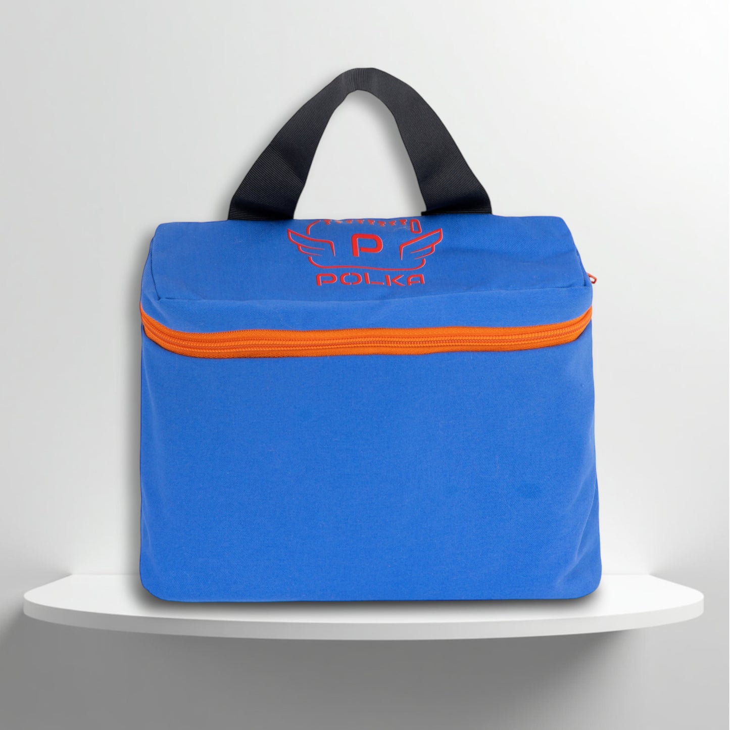 A blue, with orange details, cotton travel vanity bag with many Greek travel size personal hygiene products inside for men