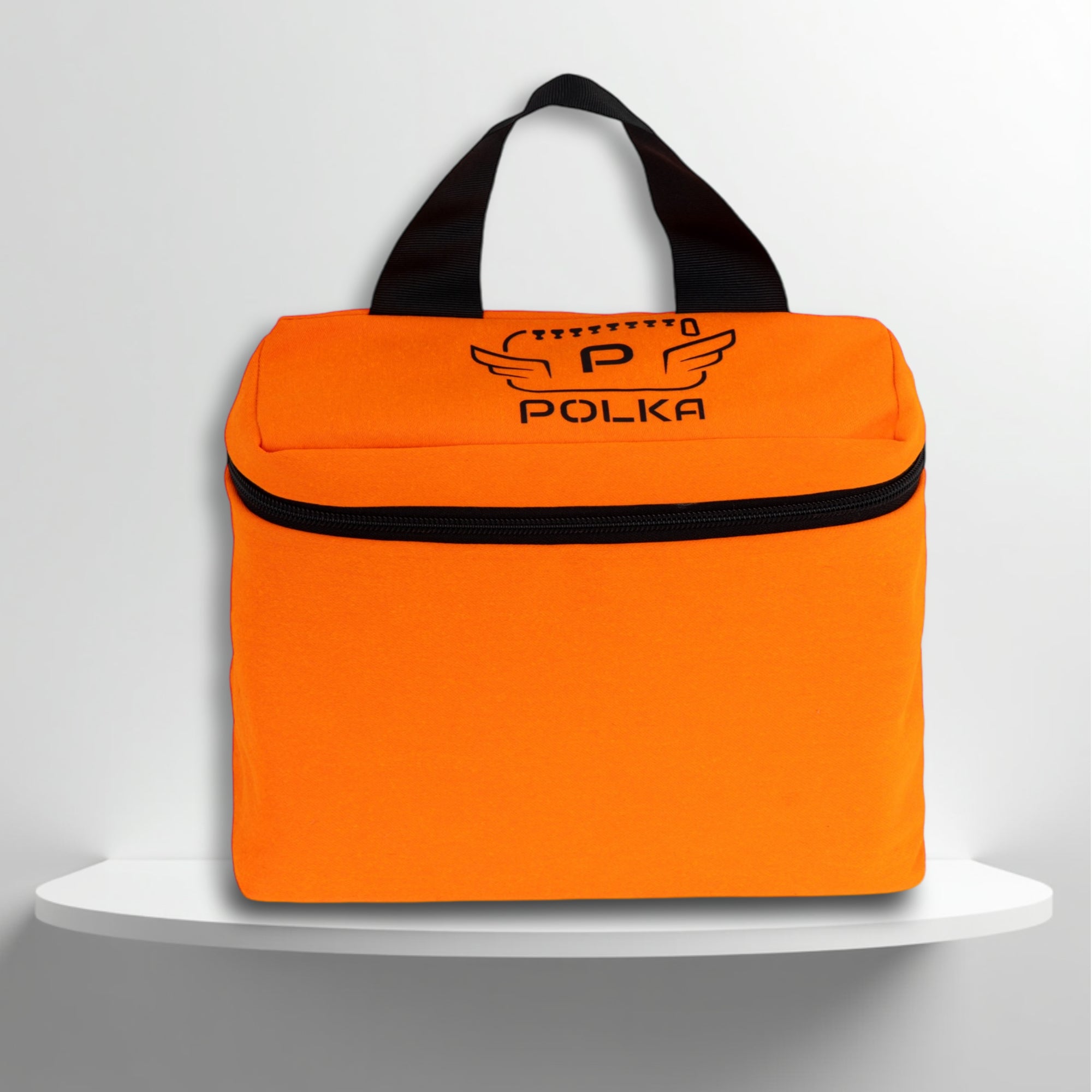 A Fluo orange cotton travel vanity bag with many Greek travel size personal hygiene products inside
