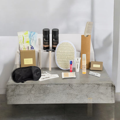 Organic Greek travel size shampoo , conditioner, shower gel, body lotion and many other toiletries that are inside the POLKA  travel vanity bag.