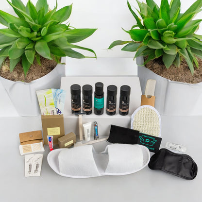 Organic Greek travel size shampoo , conditioner, shower gel, body lotion and many other toiletries that are inside the POLKA man’s travel vanity bag.