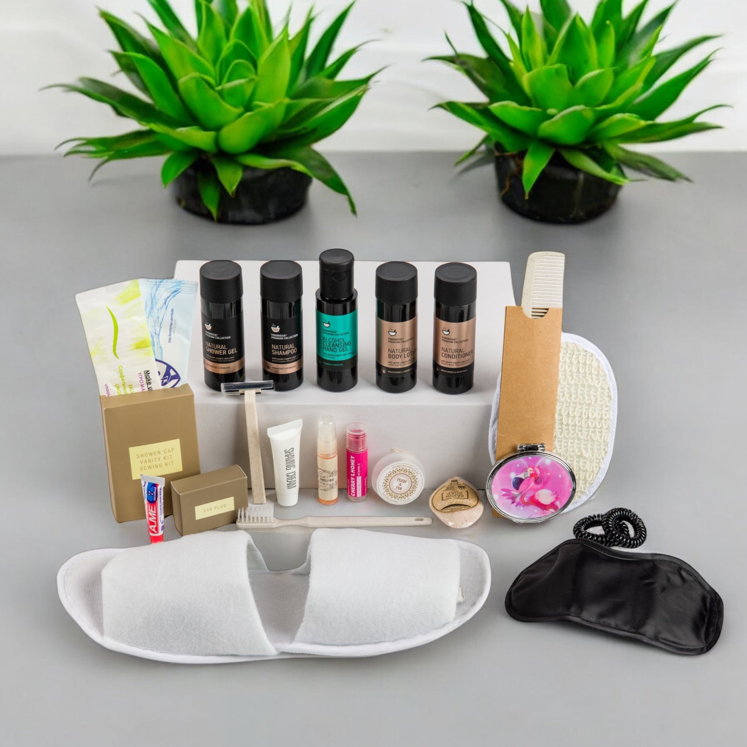 Organic Greek travel size shampoo , conditioner, shower gel, body lotion and many other toiletries that are inside the POLKA women’s travel vanity bag.