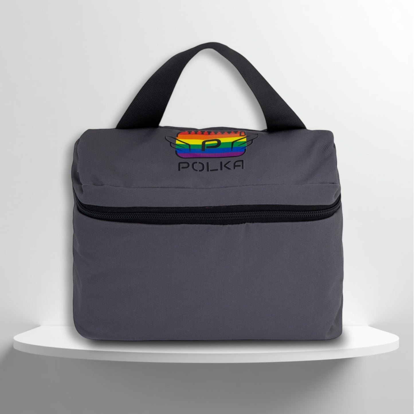 A grey cotton travel vanity bag with many Greek travel size personal hygiene products inside for the LGBTQ+ community 
