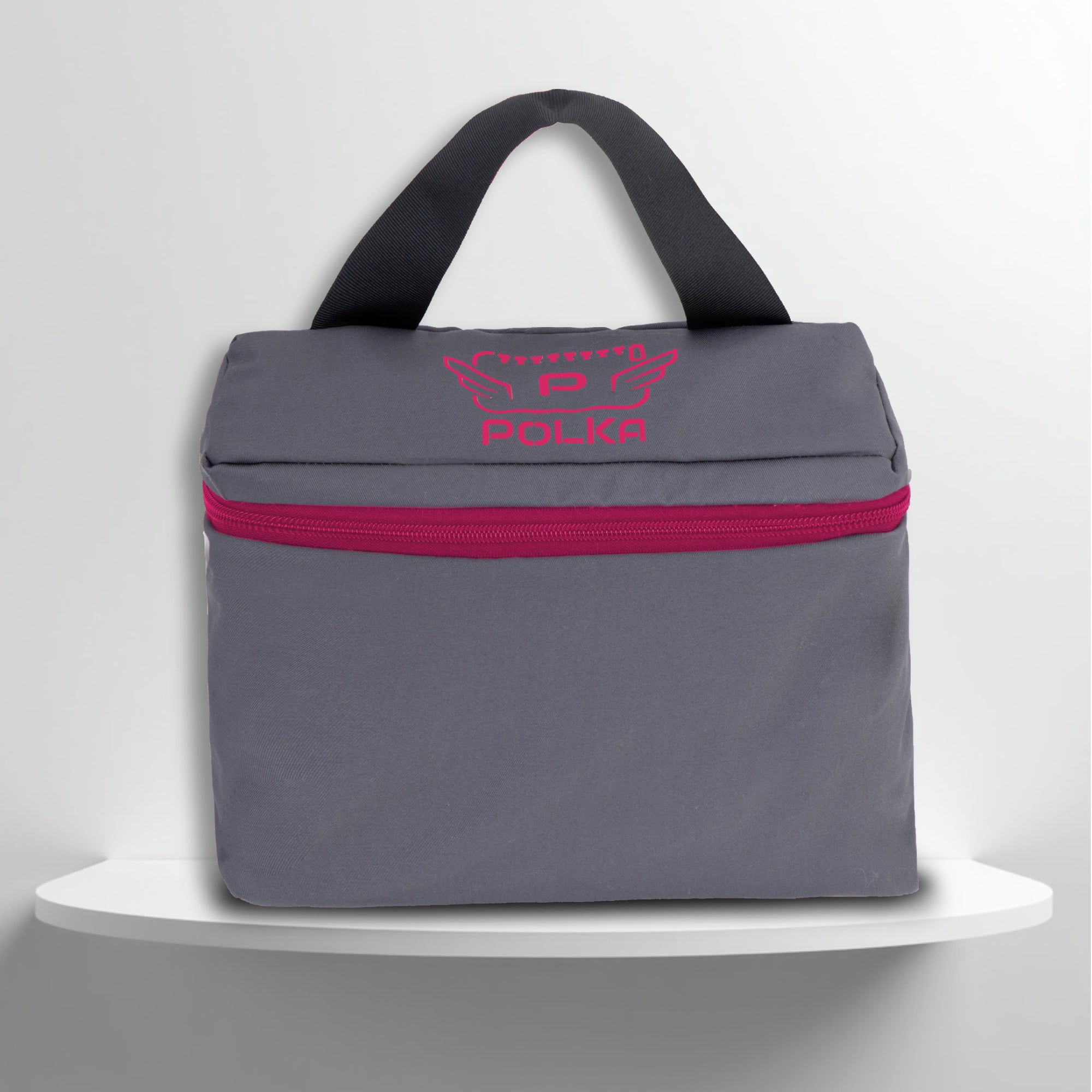 A grey cotton travel vanity bag with many Greek travel size personal hygiene products inside for the LGBTQ+ community