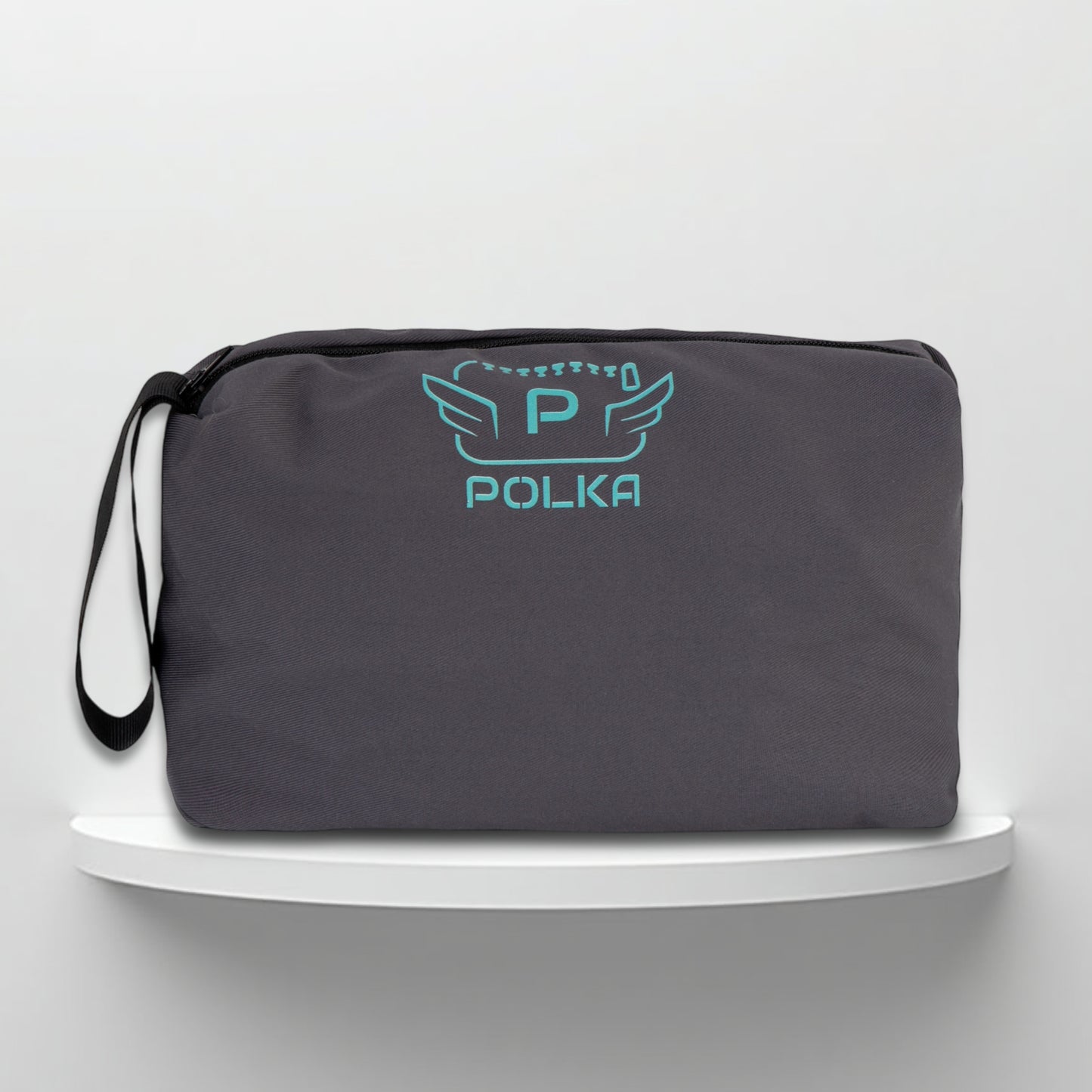 A grey cotton travel vanity bag with many Greek travel size personal hygiene products inside for men