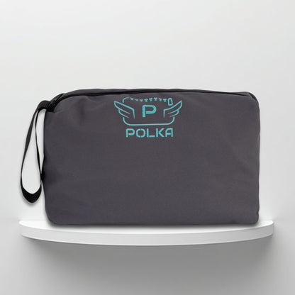 A grey cotton travel vanity bag with many Greek travel size personal hygiene products inside for men