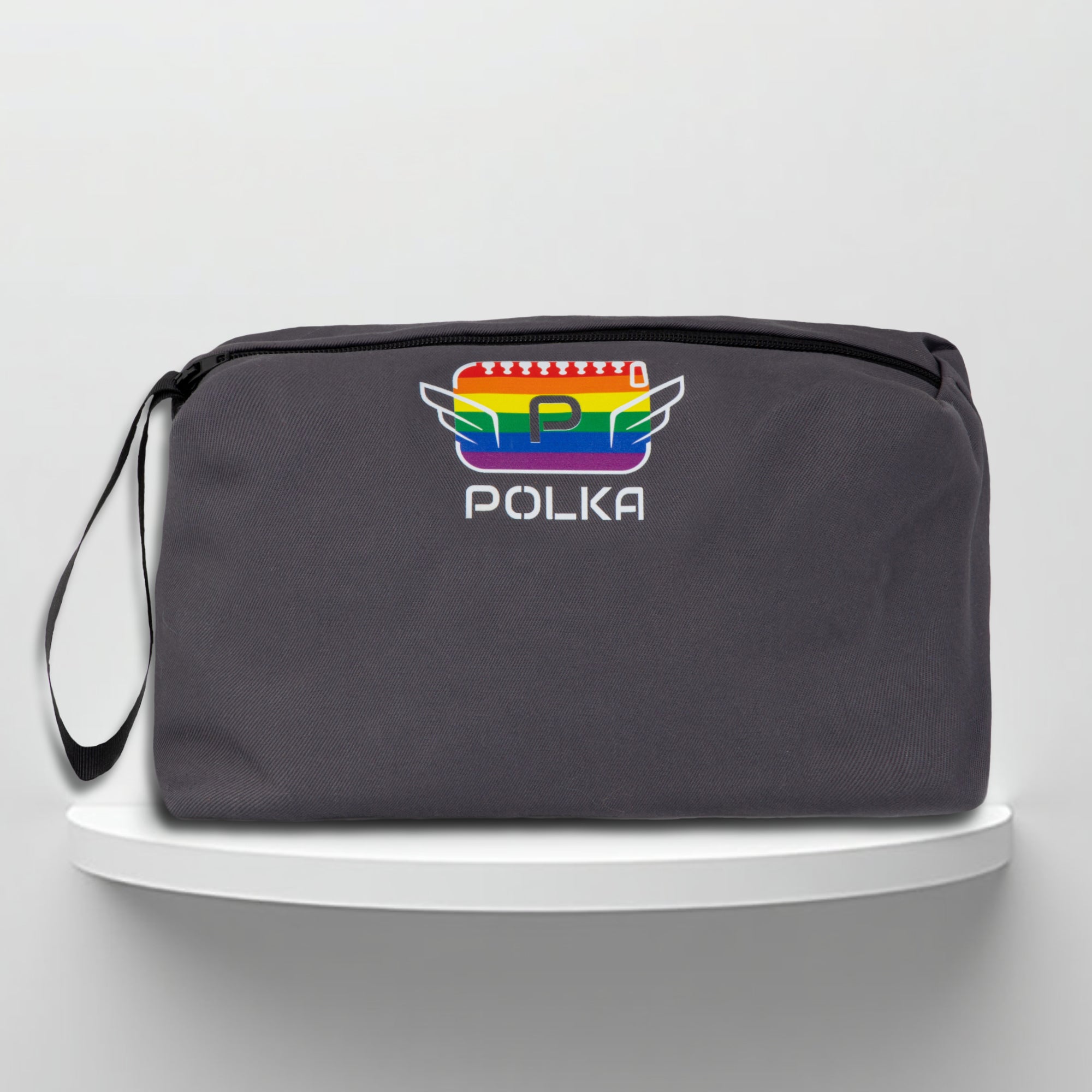 A grey cotton travel vanity bag with many Greek travel size personal hygiene products inside lgbtq+