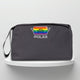 A grey cotton travel vanity bag with many Greek travel size personal hygiene products inside lgbtq+
