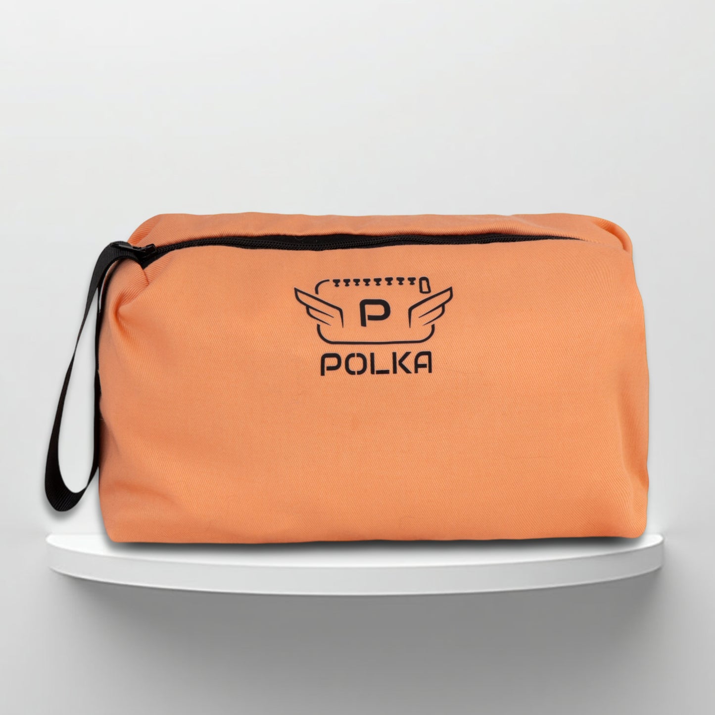 A salmon pink cotton travel vanity bag with many Greek travel size personal hygiene products inside for women
