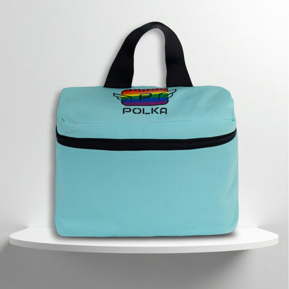 A mint cotton travel vanity bag with many Greek travel size personal hygiene products inside for the LGBTQ+ community 