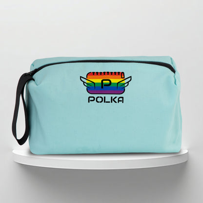 A mint cotton travel vanity bag with many Greek travel size personal hygiene products inside lgbtq+