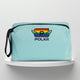 A mint cotton travel vanity bag with many Greek travel size personal hygiene products inside lgbtq+