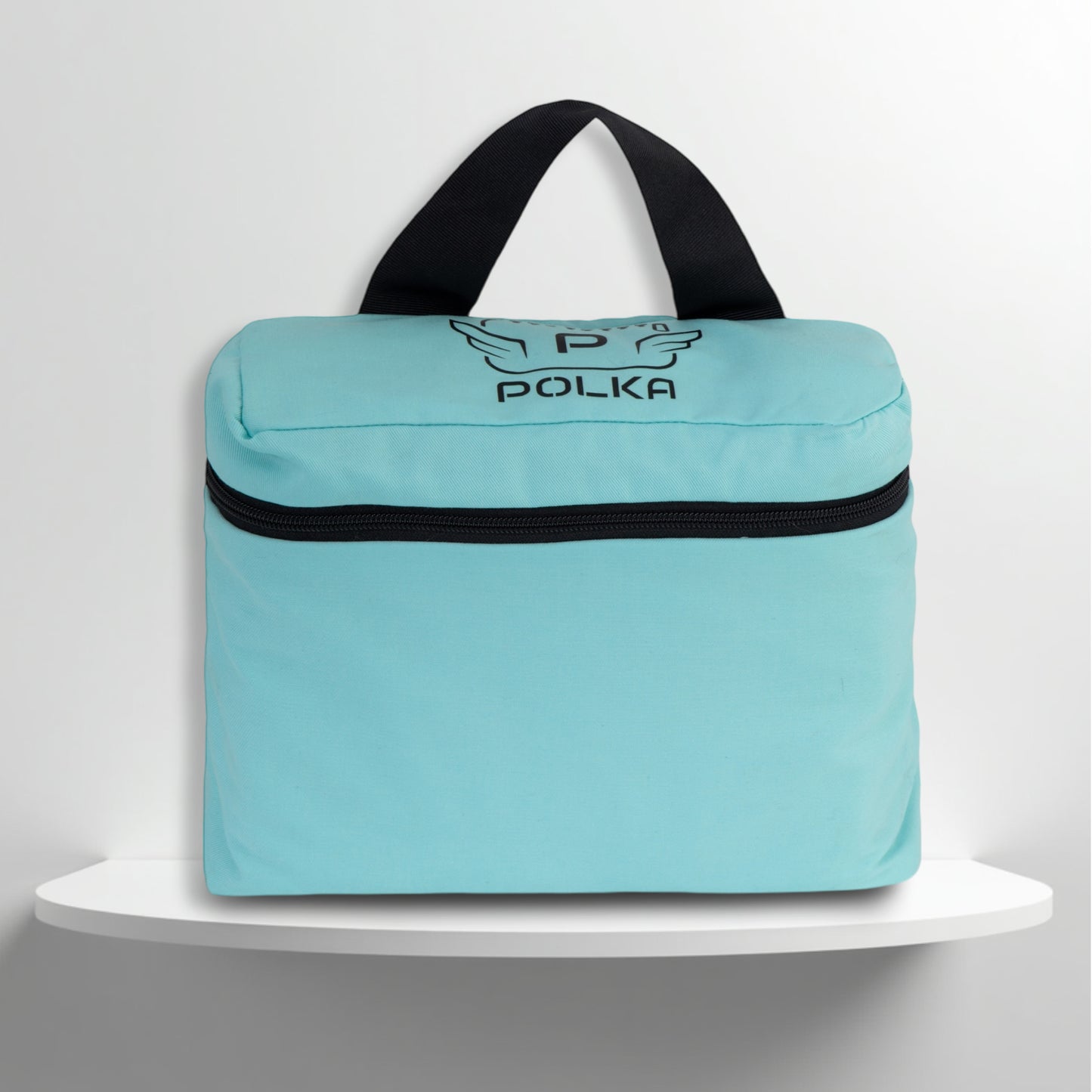 A mint cotton travel vanity bag with many Greek travel size personal hygiene products inside