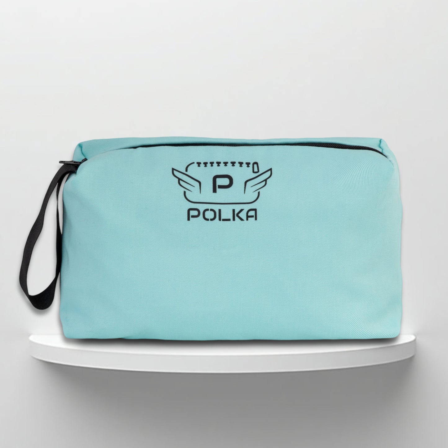A mint cotton travel vanity bag with many Greek travel size personal hygiene products inside
