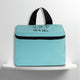 A mint  cotton travel vanity bag with many Greek travel size personal hygiene products inside for couples