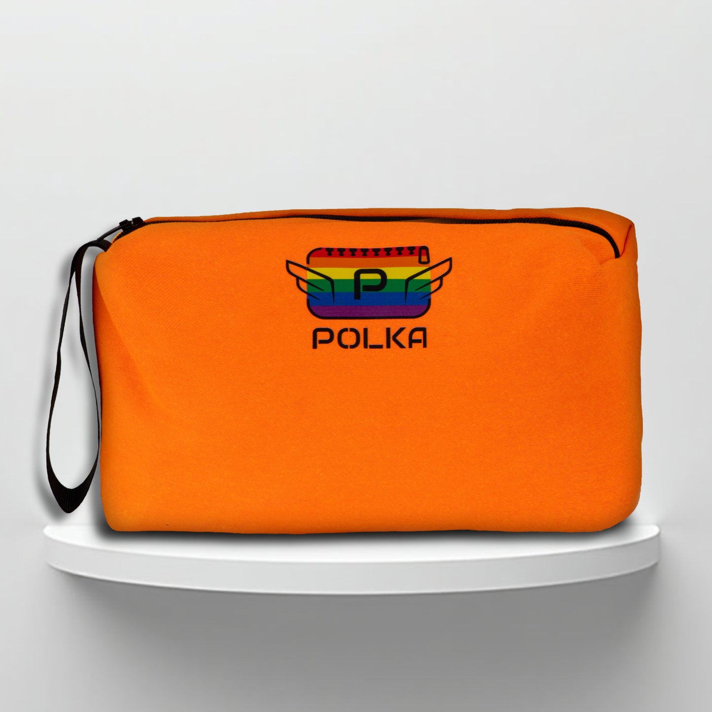 An orange cotton travel vanity bag with many Greek travel size personal hygiene products inside lgbtq+