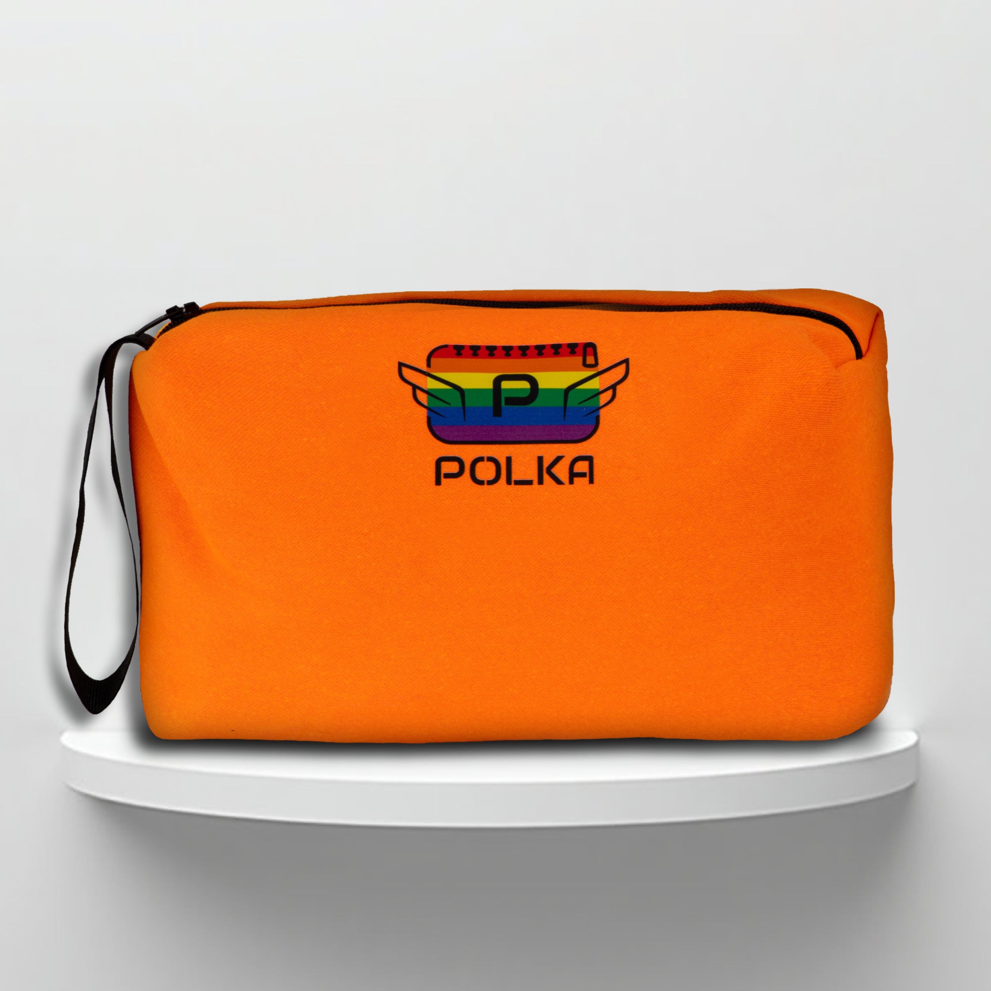 An orange cotton travel vanity bag with many Greek travel size personal hygiene products inside lgbtq+