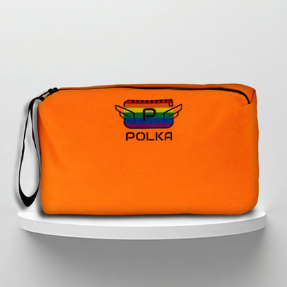 An orange cotton travel vanity bag with many Greek travel size personal hygiene products inside lgbtq+