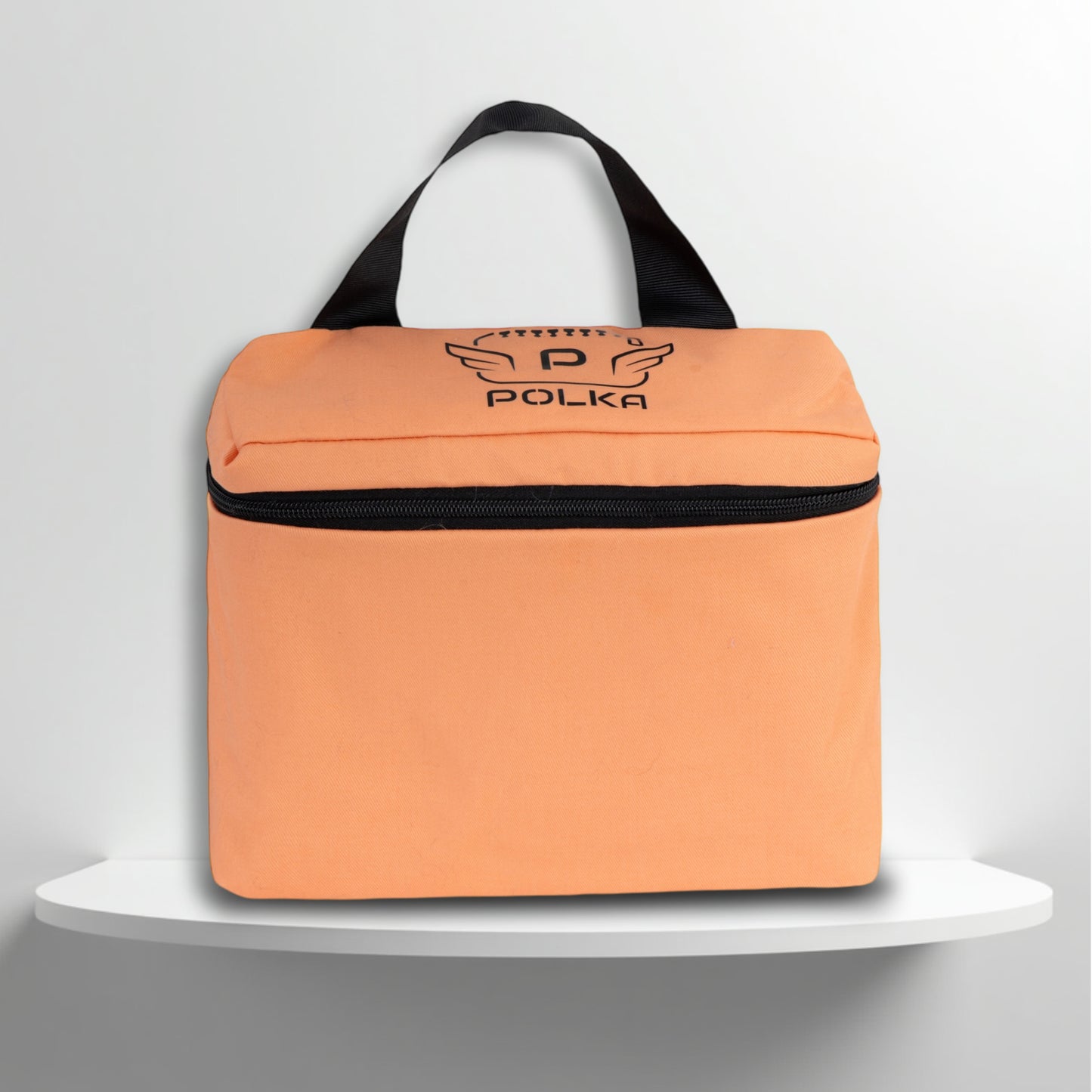 A salmon pink cotton travel vanity bag with many Greek travel size personal hygiene products inside