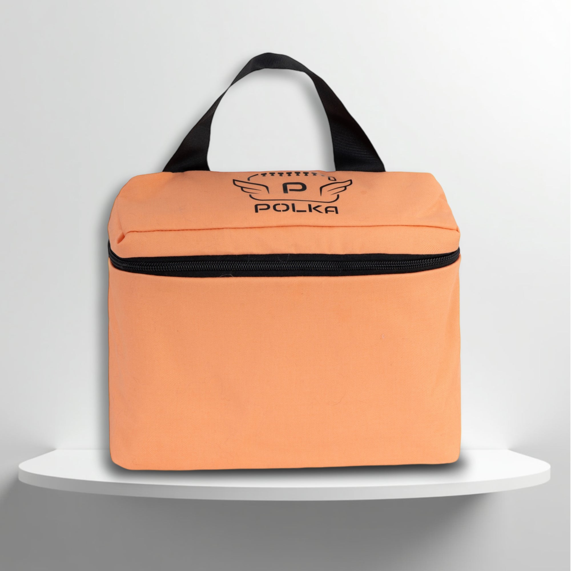 A salmon pink cotton travel vanity bag with many Greek travel size personal hygiene products inside